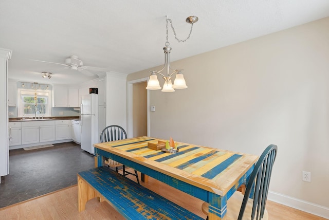 48 Woodside Dr, Kennebunk, ME 04043 - dining area with wood finished floors, a ceiling fan, and baseboards