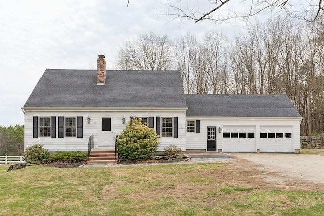 cape cod house featuring driveway, a chimney, a garage, fence, and a front lawn