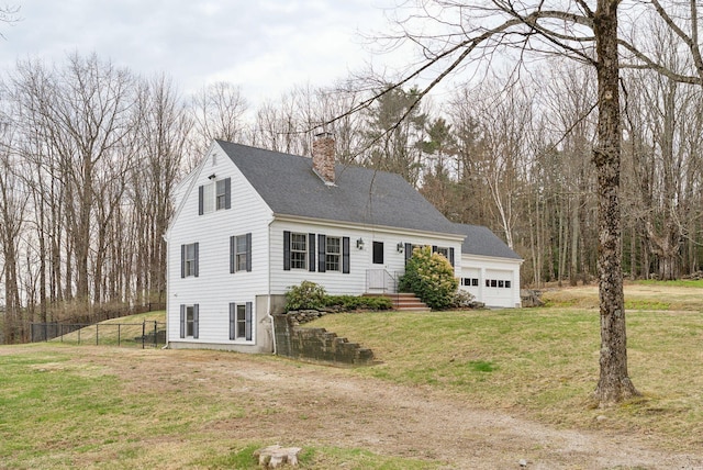 cape cod home featuring fence, a chimney, and a front yard