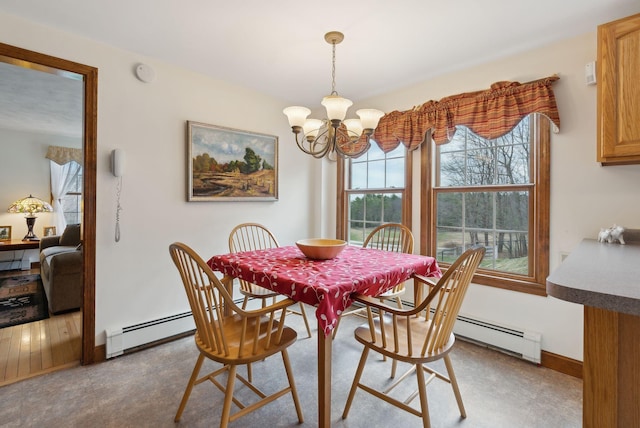 dining area featuring baseboards, a baseboard heating unit, and a notable chandelier