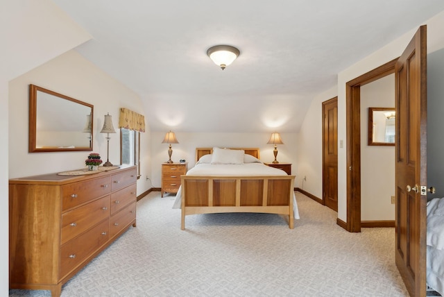 bedroom featuring baseboards and light carpet