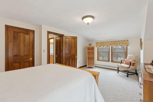 bedroom with baseboards, light carpet, and vaulted ceiling