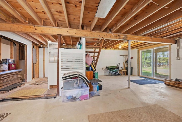 below grade area featuring concrete block wall