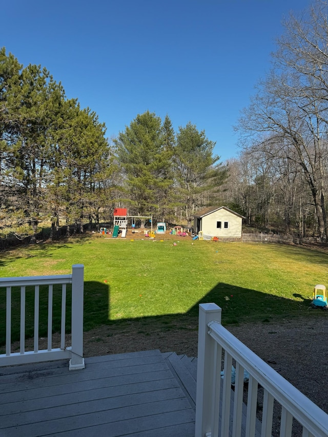 1002 River Rd, Orrington, ME 04474 - view of yard with a playground, fence, and a deck