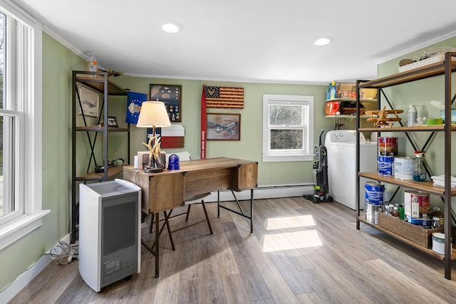 office with crown molding, wood finished floors, a baseboard heating unit, washer / dryer, and recessed lighting