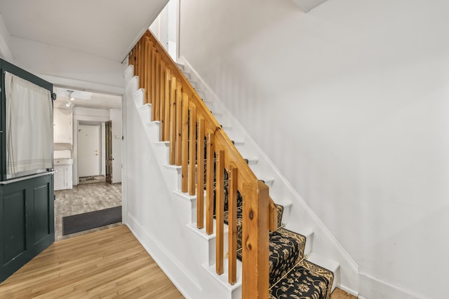 stairway with wood finished floors