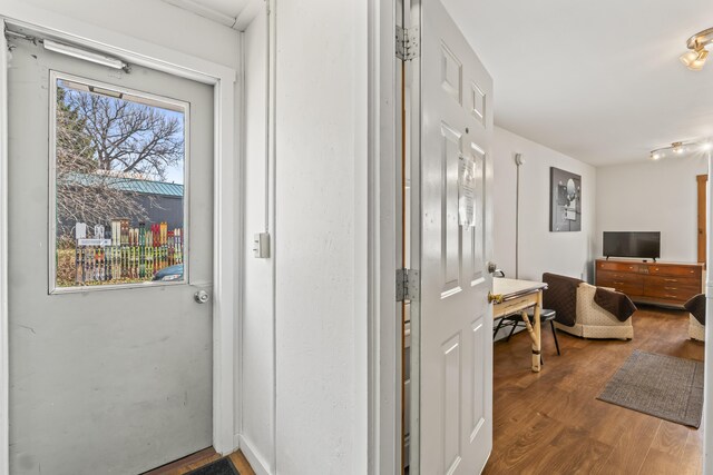 corridor with wood finished floors