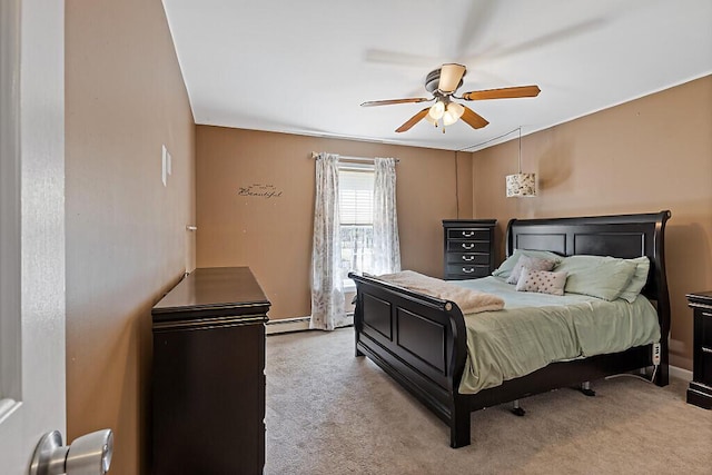 carpeted bedroom with baseboards and a ceiling fan