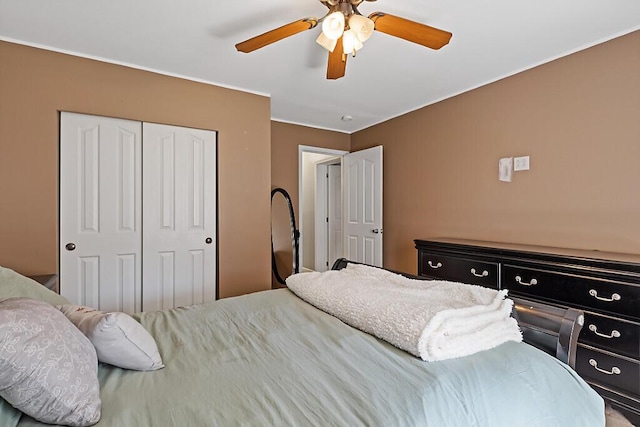 bedroom featuring a ceiling fan and a closet