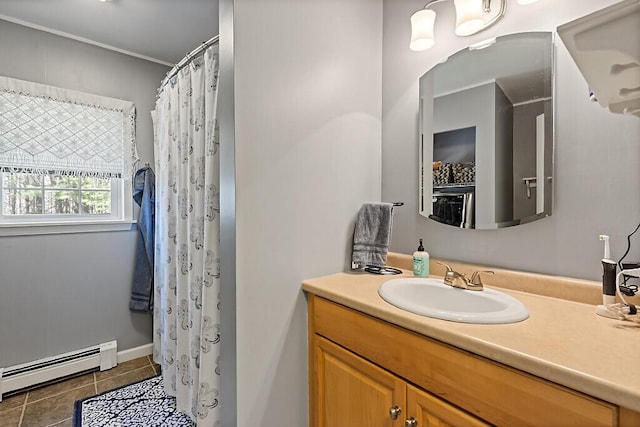 bathroom with a shower with curtain, baseboard heating, tile patterned flooring, and vanity