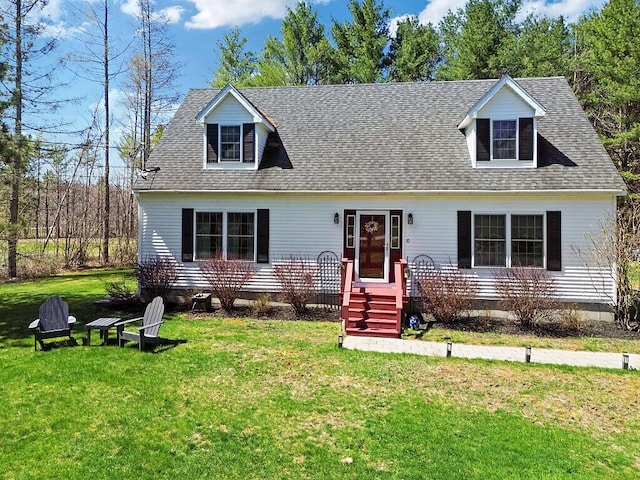 cape cod-style house with a shingled roof and a front lawn