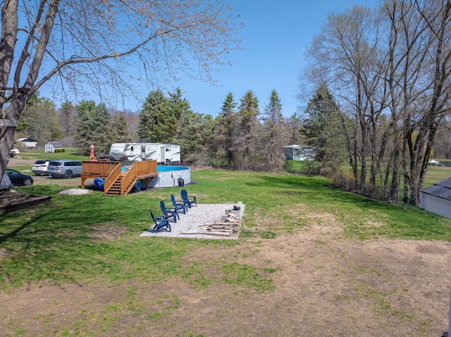 view of yard with stairway and a wooden deck