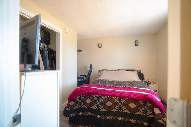 bedroom with wood finished floors
