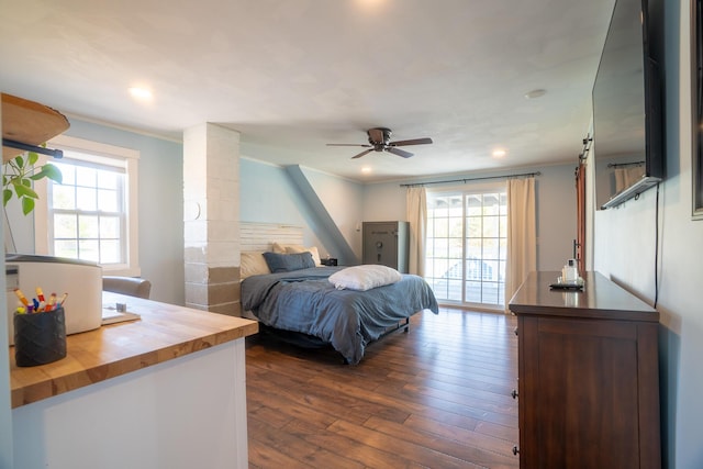 bedroom featuring recessed lighting, ornamental molding, ceiling fan, and dark wood-style floors