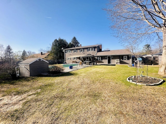 20 Patrick St, Skowhegan, ME 04976 - back of property with a storage shed, an outdoor structure, and a patio area