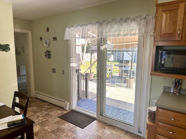 20 Patrick St, Skowhegan, ME 04976 - doorway to outside featuring baseboard heating