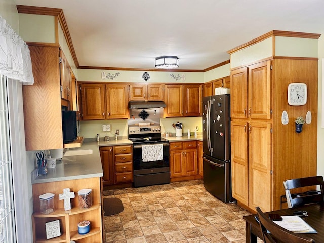 20 Patrick St, Skowhegan, ME 04976 - kitchen with stainless steel range with electric cooktop, freestanding refrigerator, under cabinet range hood, light countertops, and brown cabinets