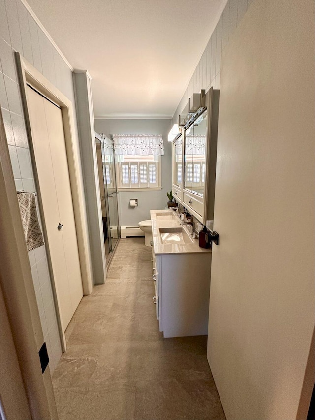 20 Patrick St, Skowhegan, ME 04976 - full bath with ornamental molding, toilet, a shower stall, baseboard heating, and vanity