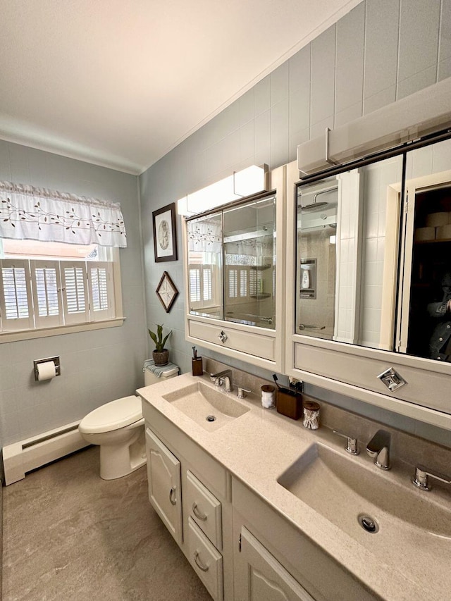 20 Patrick St, Skowhegan, ME 04976 - bathroom featuring a baseboard radiator, toilet, double vanity, and a shower