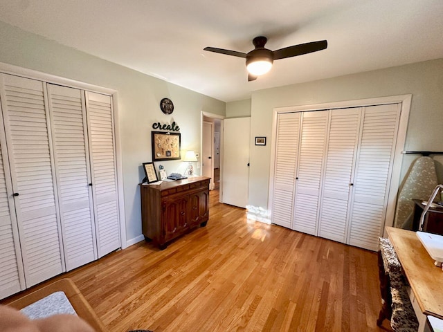 20 Patrick St, Skowhegan, ME 04976 - bedroom featuring light wood finished floors, baseboards, multiple closets, and ceiling fan