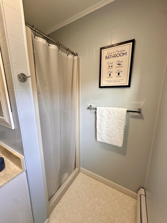 20 Patrick St, Skowhegan, ME 04976 - bathroom with a shower with shower curtain, a baseboard heating unit, and crown molding