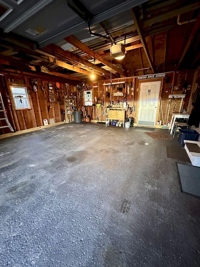 20 Patrick St, Skowhegan, ME 04976 - garage with a garage door opener and a workshop area