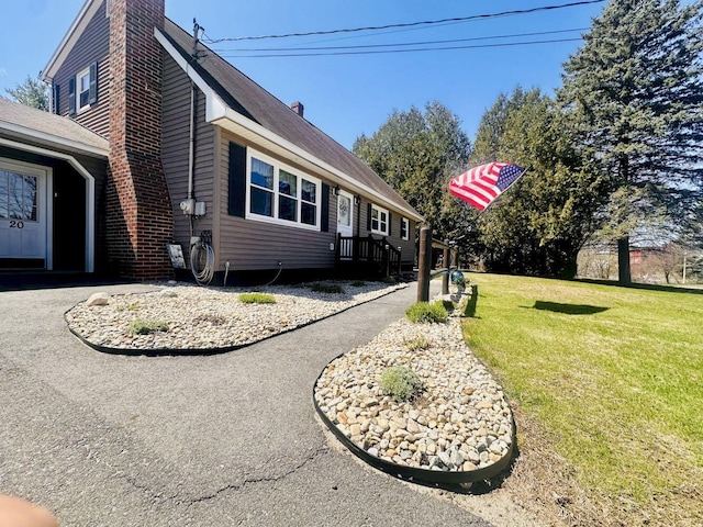 20 Patrick St, Skowhegan, ME 04976 - view of side of property featuring a chimney and a lawn