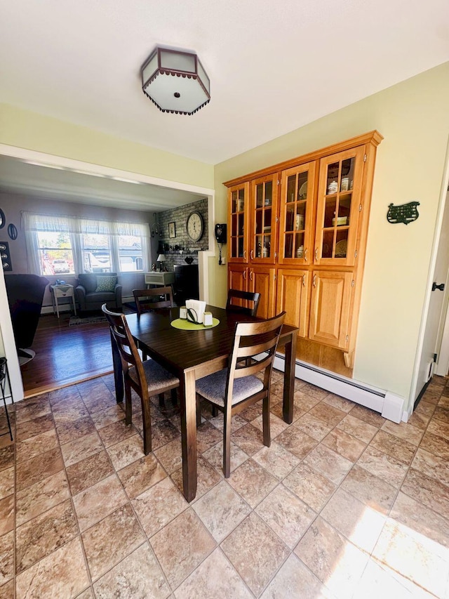 20 Patrick St, Skowhegan, ME 04976 - dining room featuring a baseboard heating unit, light stone finish floors, and baseboards