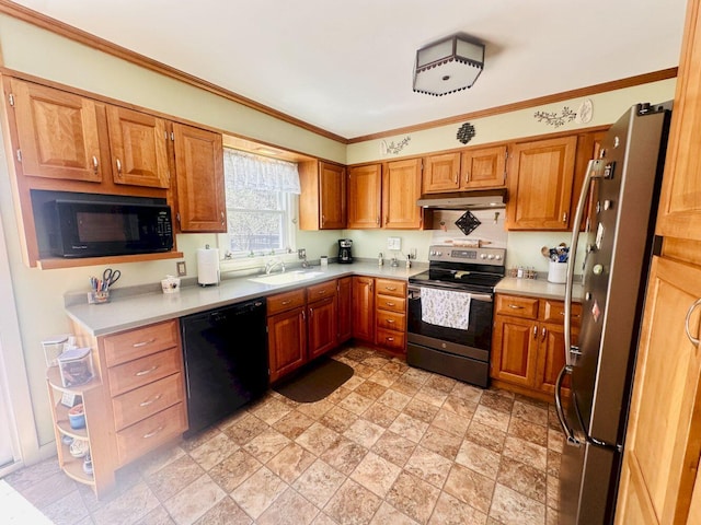 20 Patrick St, Skowhegan, ME 04976 - kitchen featuring black appliances, a sink, under cabinet range hood, light countertops, and brown cabinetry