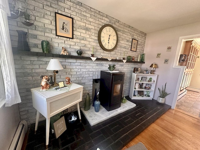 20 Patrick St, Skowhegan, ME 04976 - detailed view of a baseboard heating unit and a wood stove