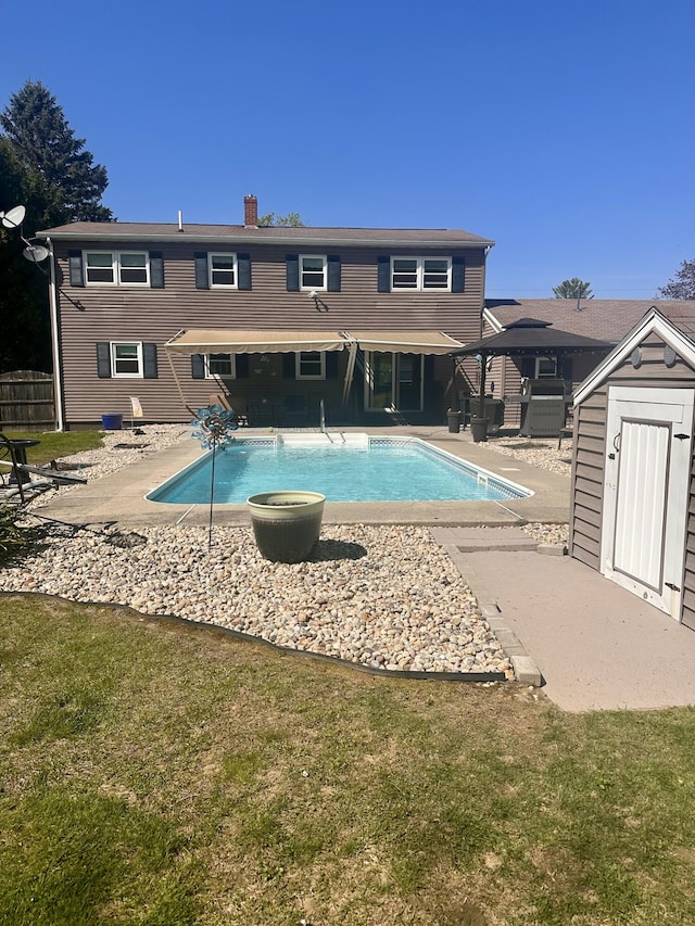 20 Patrick St, Skowhegan, ME 04976 - swimming pool featuring a patio area, a shed, and an outbuilding