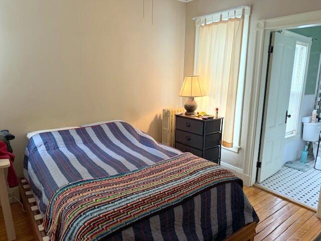 bedroom with wood finished floors