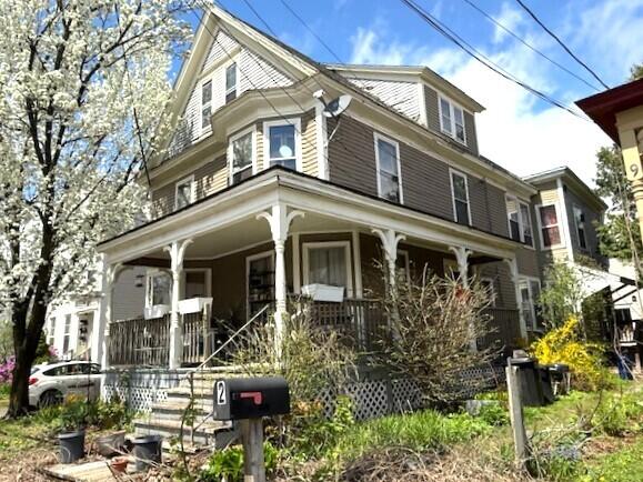 victorian-style house featuring a porch