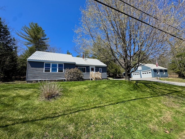 622 Methodist Rd, Westbrook, ME 04092 - view of front of property featuring driveway, metal roof, a front yard, and a garage
