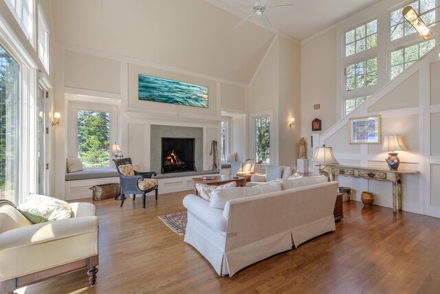8 Spring Ln, Mount Desert, ME 04660 - living area featuring high vaulted ceiling, a fireplace, a ceiling fan, light wood-style flooring, and ornamental molding