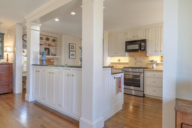 8 Spring Ln, Mount Desert, ME 04660 - kitchen featuring high end stainless steel range, black microwave, ornate columns, wood finished floors, and recessed lighting