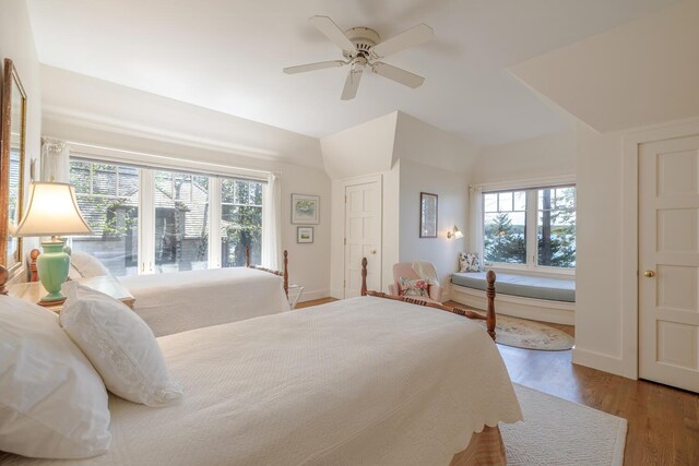 8 Spring Ln, Mount Desert, ME 04660 - bedroom with multiple windows, wood finished floors, vaulted ceiling, ceiling fan, and baseboards