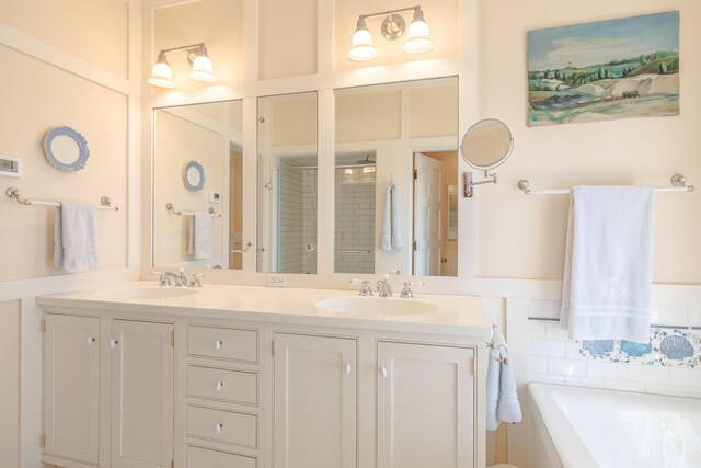 8 Spring Ln, Mount Desert, ME 04660 - full bathroom with a stall shower, double vanity, and a garden tub