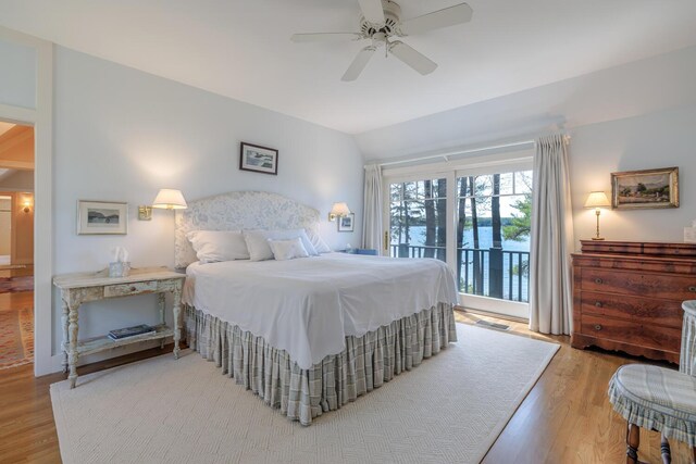 8 Spring Ln, Mount Desert, ME 04660 - bedroom with access to outside, wood finished floors, a ceiling fan, and vaulted ceiling