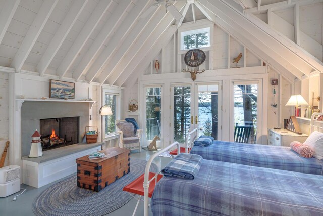 8 Spring Ln, Mount Desert, ME 04660 - bedroom featuring access to exterior, a warm lit fireplace, and high vaulted ceiling