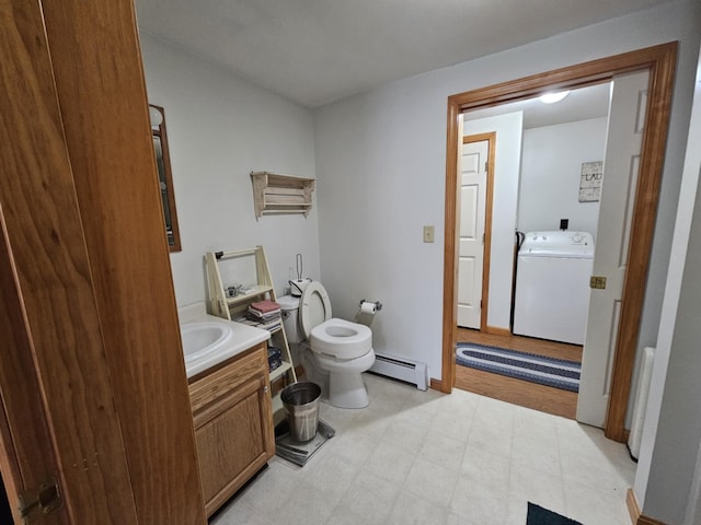 32 Ridge Rd, Sumner, ME 04292 - bathroom featuring vanity, toilet, washer / clothes dryer, baseboard heating, and tile patterned floors