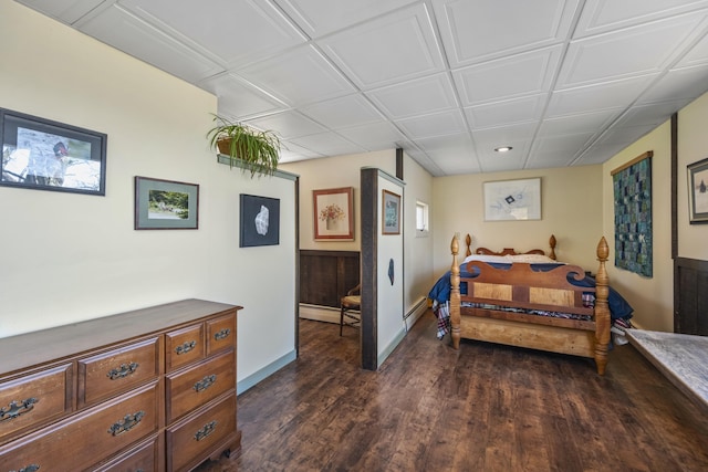 bedroom featuring dark wood-style flooring, baseboards, recessed lighting, and baseboard heating