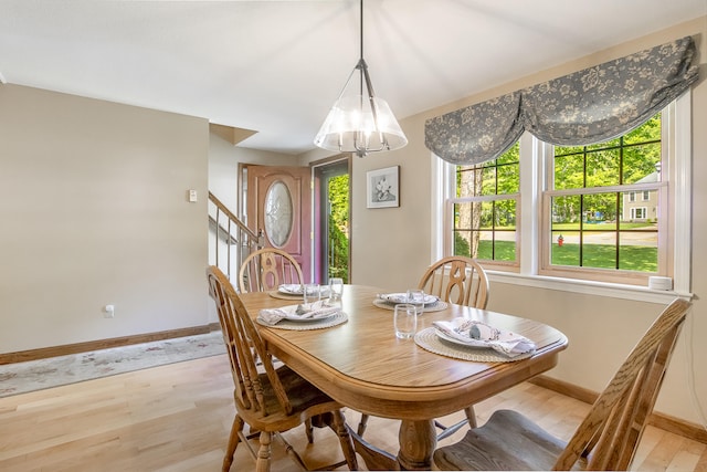 51 Beaver Dam Rd, South Berwick, ME 03908 - dining room featuring baseboards, light wood-style flooring, healthy amount of natural light, and a chandelier