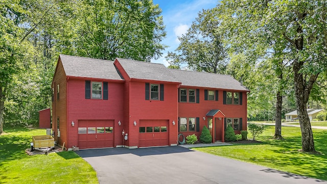 51 Beaver Dam Rd, South Berwick, ME 03908 - view of front facade with driveway, a garage, a front lawn, and roof with shingles