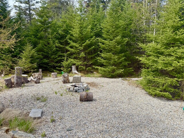 8 Berry Ln, Vinalhaven, ME 04863 - view of yard featuring an outdoor fire pit