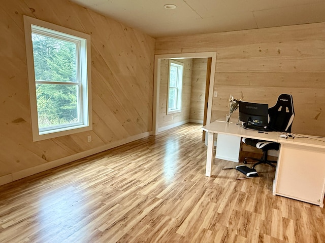 8 Berry Ln, Vinalhaven, ME 04863 - office area featuring light wood-style flooring, wooden walls, and baseboards