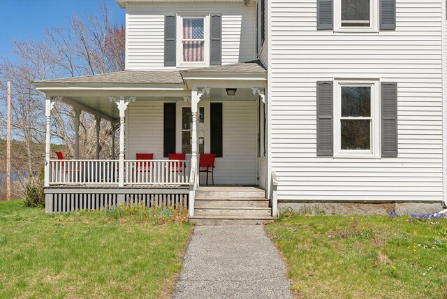 193 Spec Pond Rd, Porter, ME 04068 - view of front of home with a porch and a front lawn