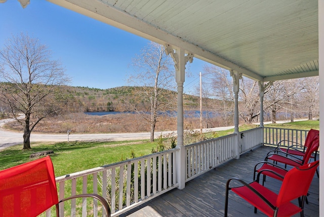 193 Spec Pond Rd, Porter, ME 04068 - deck featuring a lawn, a water view, and a porch