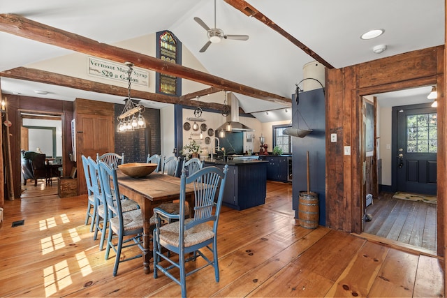 875 N Parish Rd, Turner, ME 04282 - dining area featuring beamed ceiling, ceiling fan, light wood-style flooring, and high vaulted ceiling