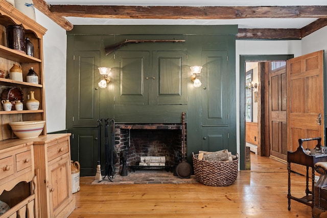 875 N Parish Rd, Turner, ME 04282 - living area with light wood-style flooring, beam ceiling, and a fireplace